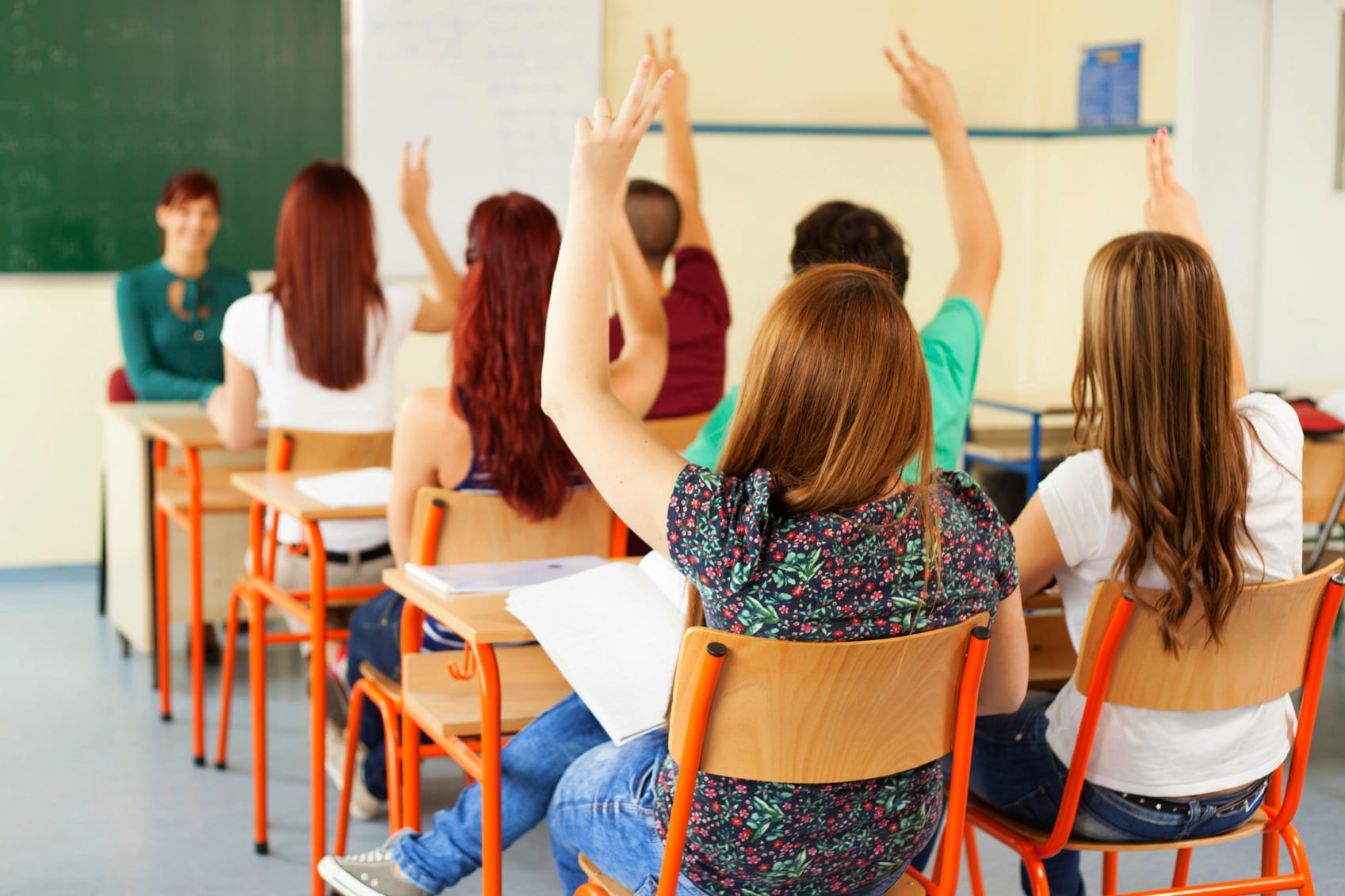 Group of teenagers sitting in classroom
